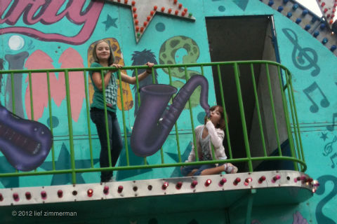TWO playing the Saxophone on the Sandy Ride.